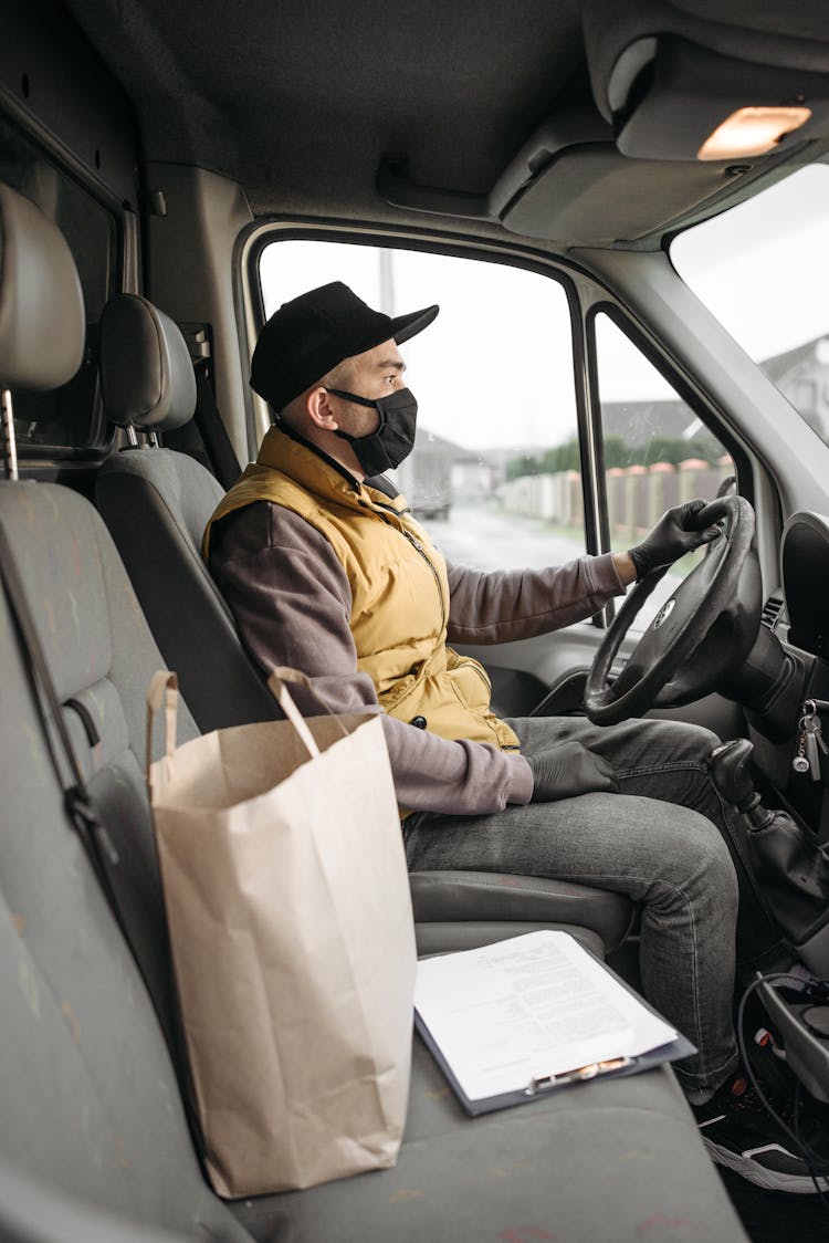 Deliveryman Driving A Van