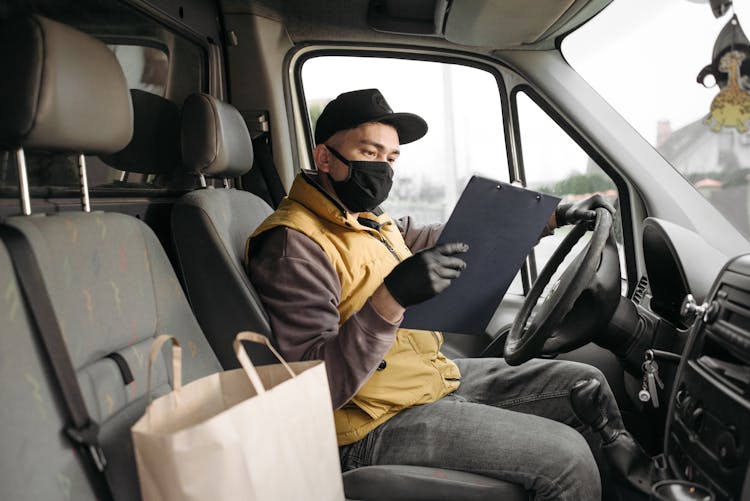 Man Holding A Clipboard