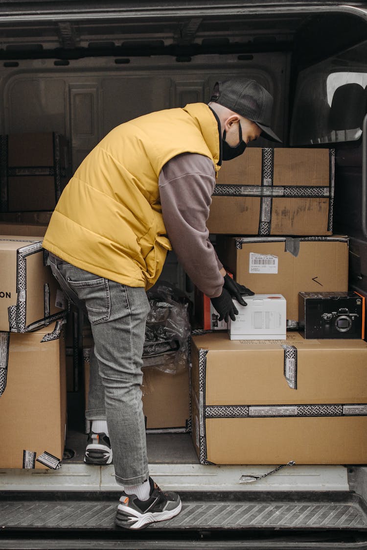 Man Standing Inside A Delivery Van