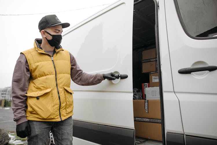 Man Closing A Door Of A Van