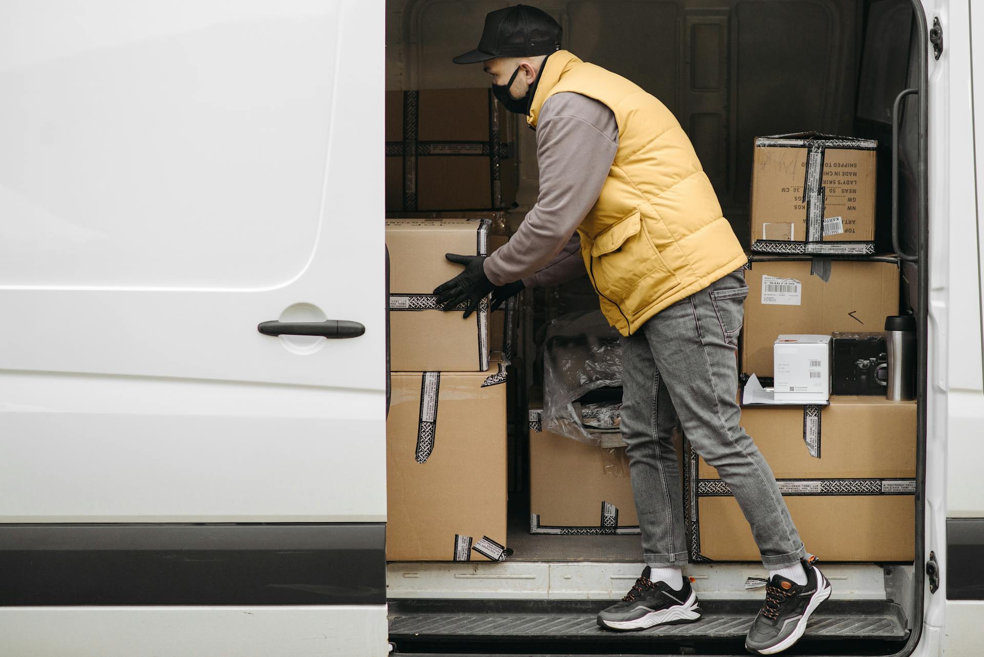 A Deliveryman Arranging Packages