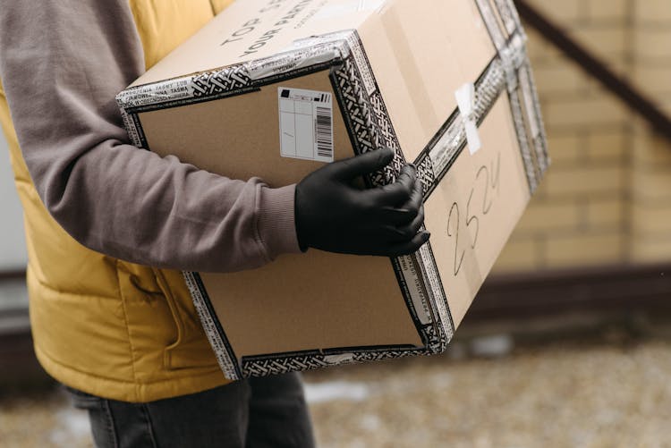 A Courier Holding A Package