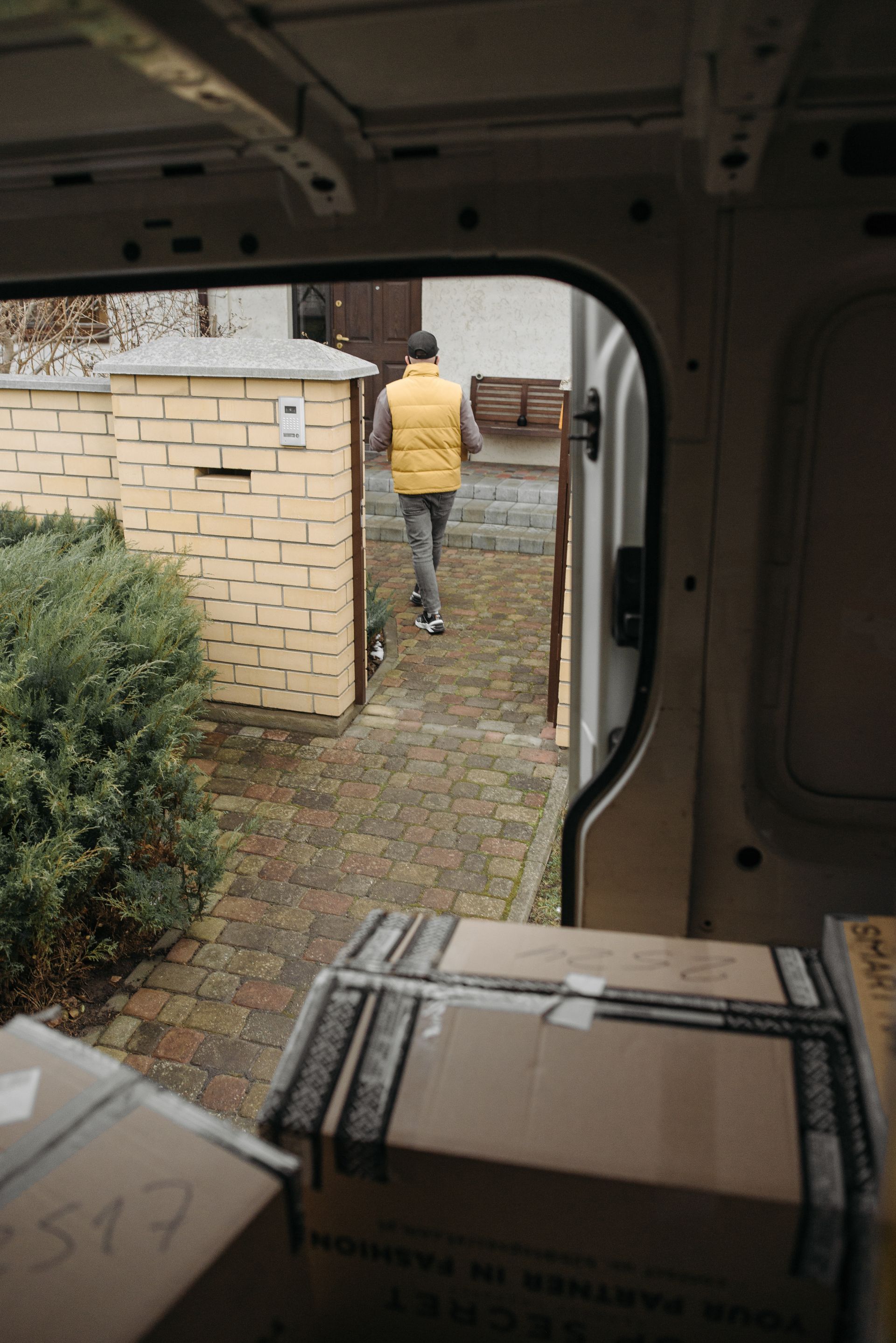 Courier delivering a parcel to a customer doorstep