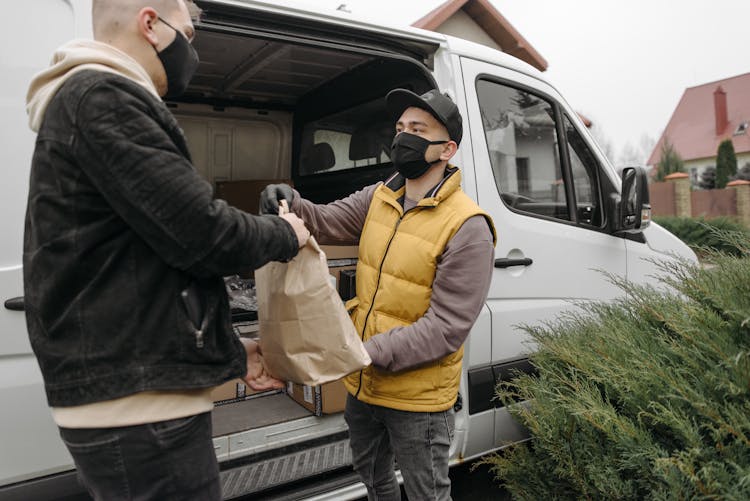 Man Delivering A Paper Bag