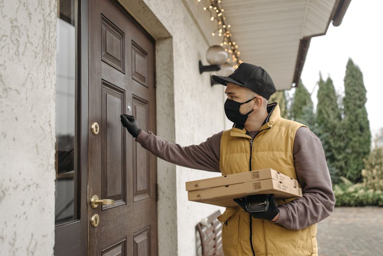 Delivery Man Knocking On A Door