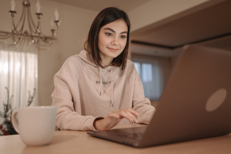 Woman on laptop in coffee shop