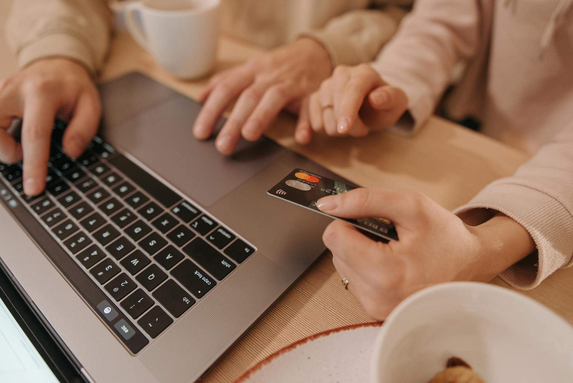 Close-Up Shot of Two People Shopping Online