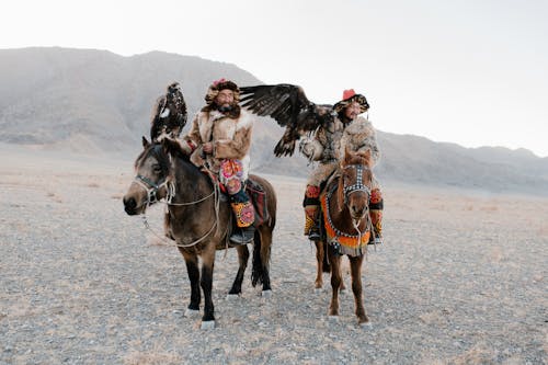 Men in the Desert Riding Horses