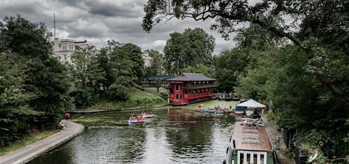 People in Kayaks on River