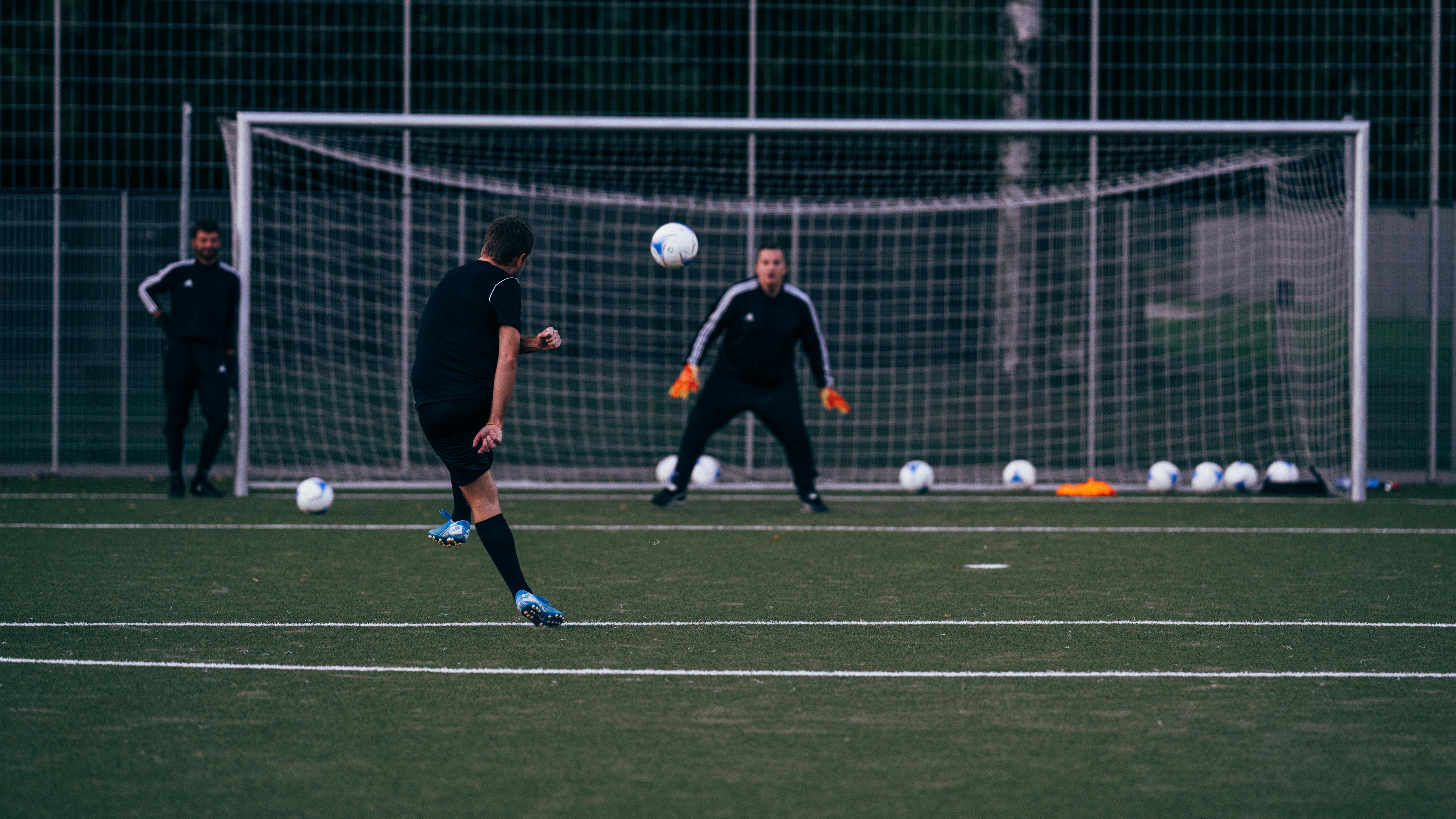 team playing football on sports field