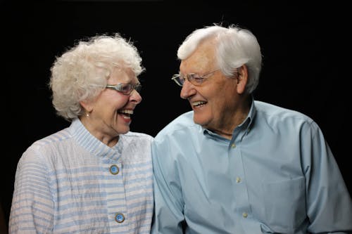 Free Portrait of Laughing Elderly Couple Stock Photo