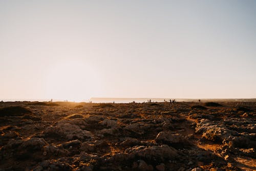 Scenery with Rocks in a Desert at Sunset