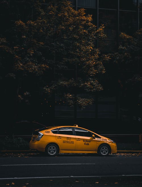 Yellow Taxi on Road