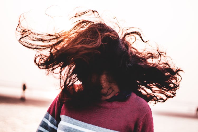 Faceless Woman Shaking Head With Hair