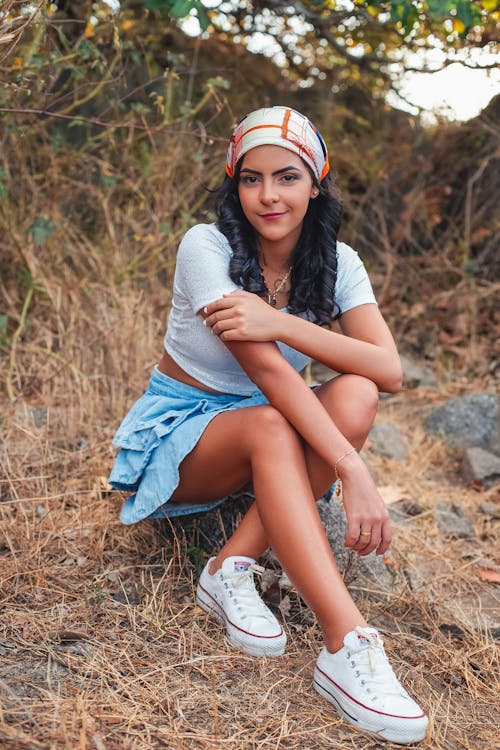 Beautiful Woman Sitting on the Rock