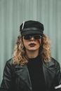 Woman in Black Leather Jacket Wearing Black Sunglasses