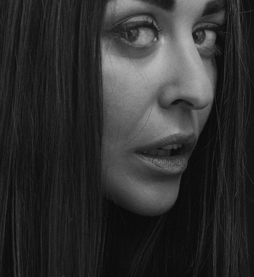 Free Monochrome close-up portrait of a woman with striking features in Kyiv, Ukraine. Stock Photo