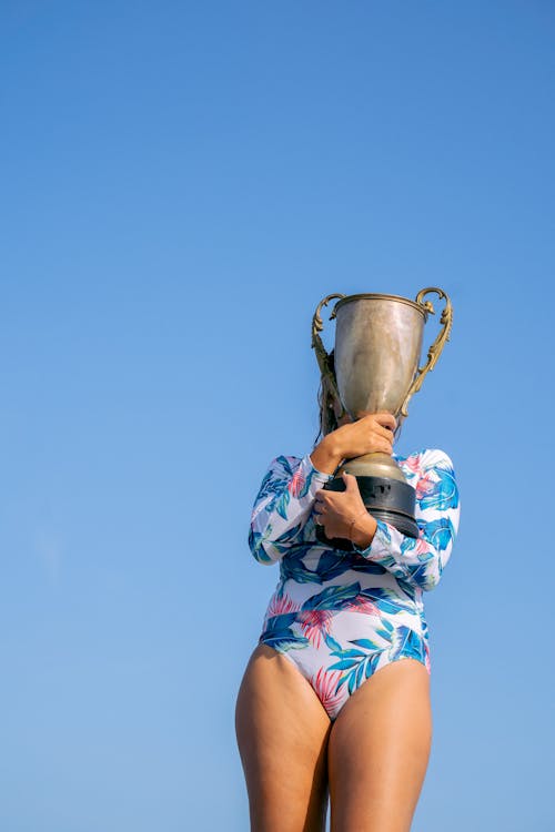 Free 
A Woman Holding a Trophy Stock Photo