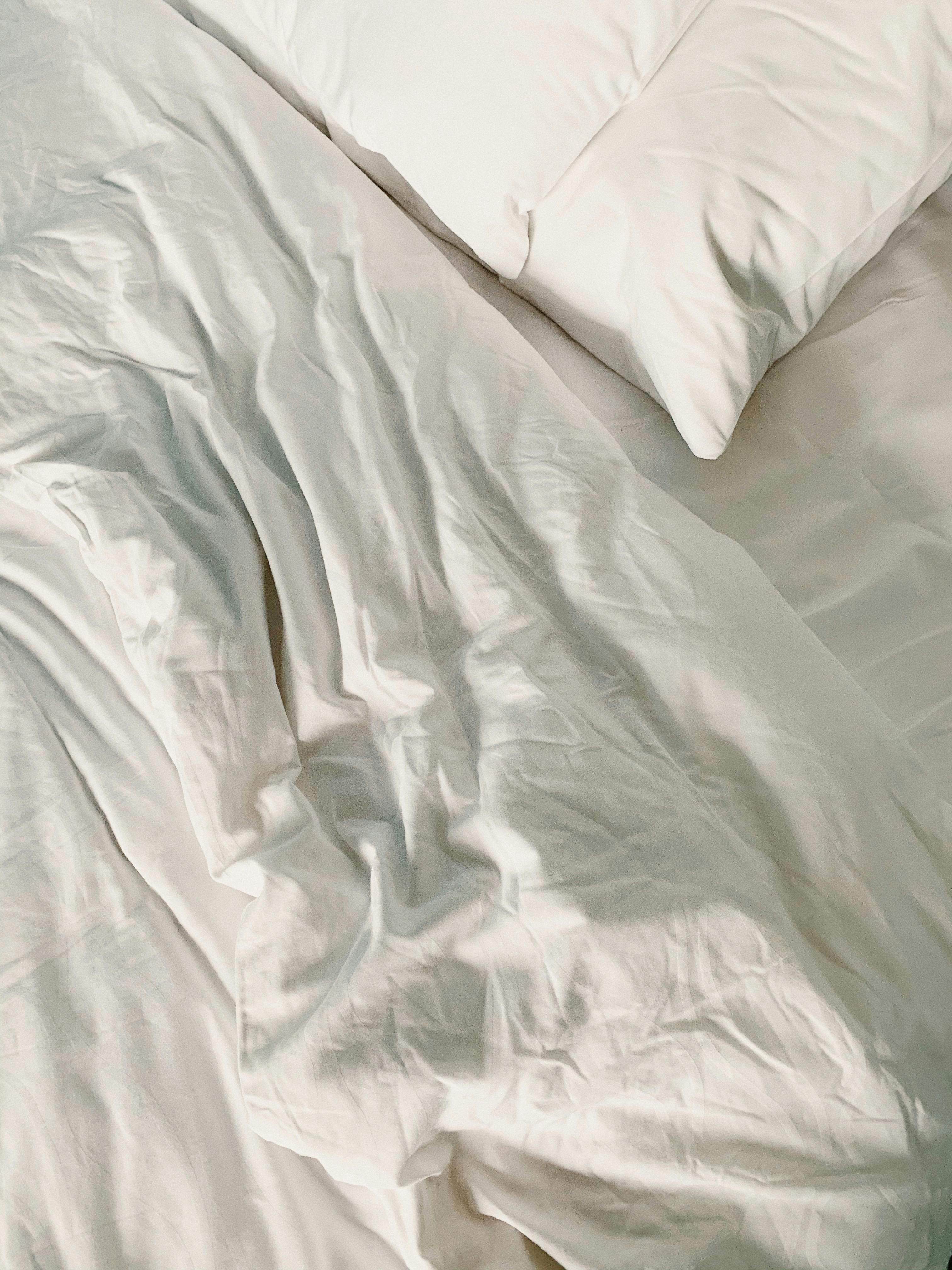 White Pillow and Bed Sheet · Free Stock Photo