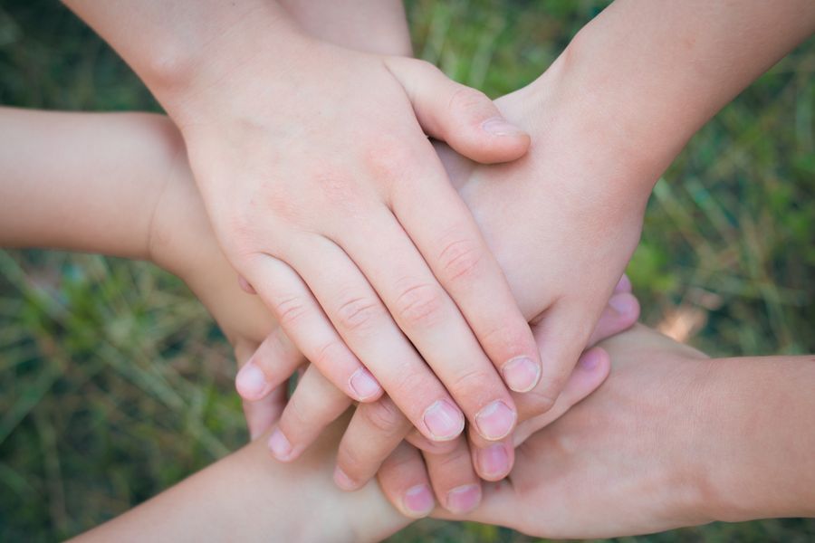 Hands clasped together in support