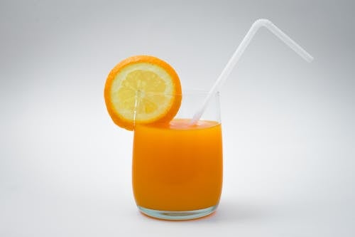 Immagine gratuita di arancia, bicchiere, cannuccia