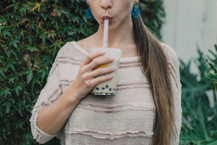 Person Drinking Boba Tea