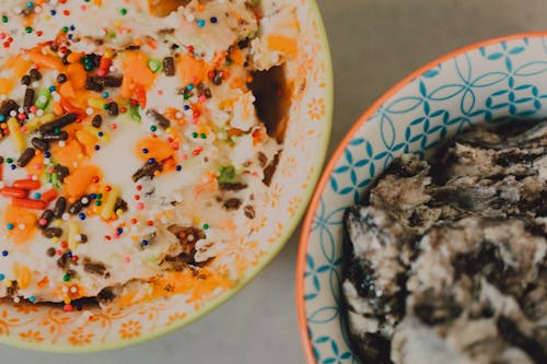 Close-Up Shot of Two Different Ice Cream Flavors in Bowls