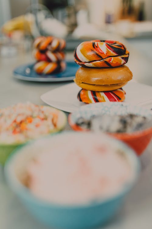 Close-Up Shot of Stack of Colorful Bagels on a Plate