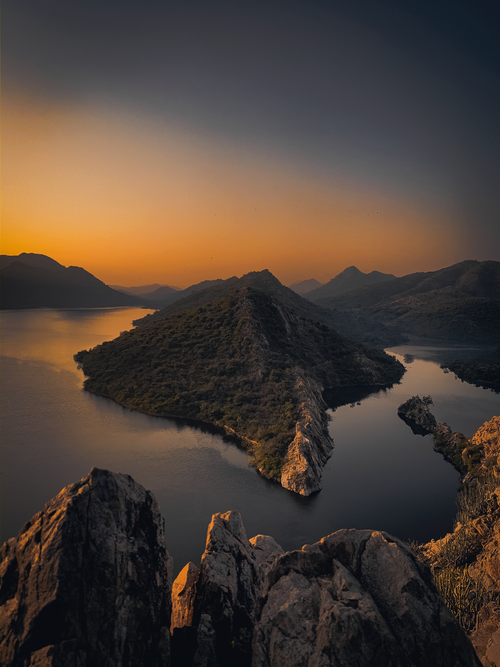 Free A breathtaking aerial view of Morwaniya's serene landscape during a golden sunset. Stock Photo