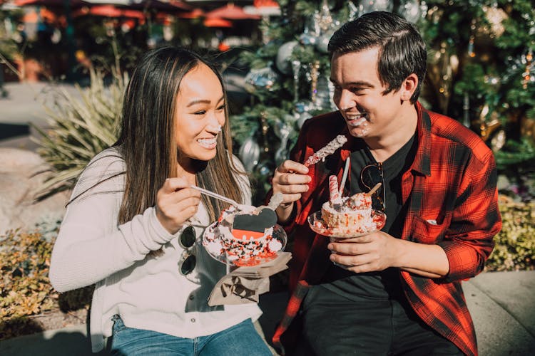 Happy Couple Eating Dessert Together