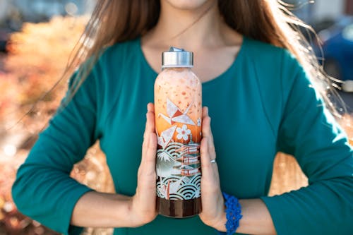 A Woman holding a Tumbler 