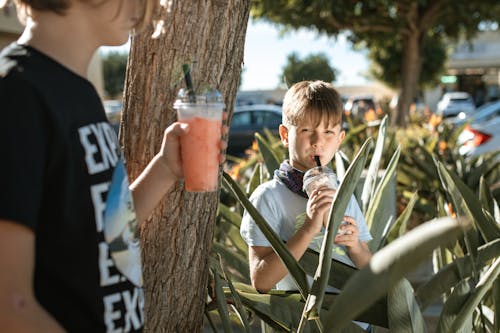 A Boy Drinking a Beverage