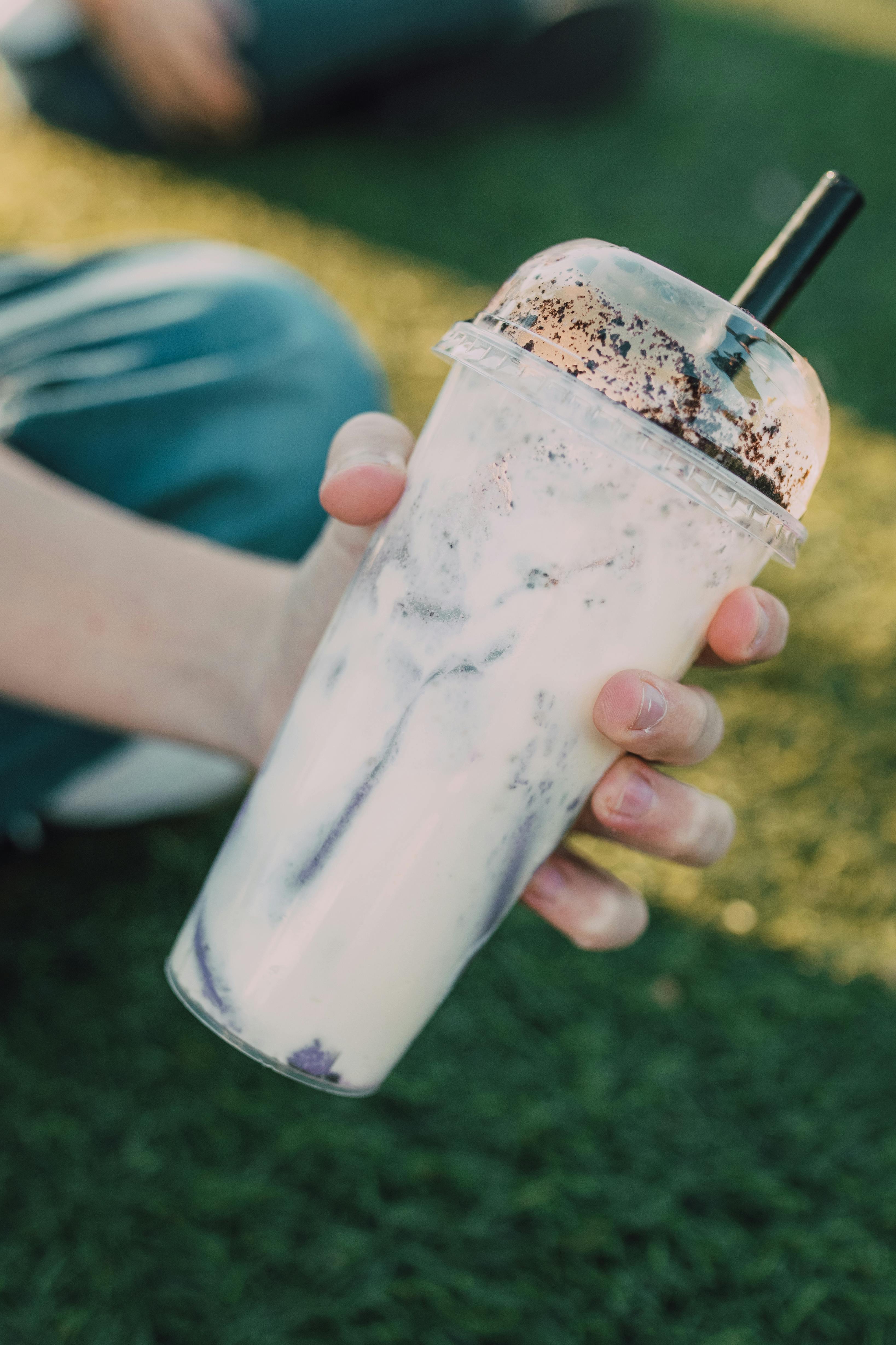 Set Of Different Milkshakes In Disposable Plastic Glasses Stock