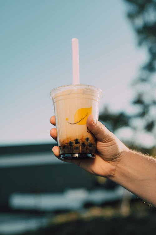 Free A Person Holding a Cup of Bubble Tea Stock Photo