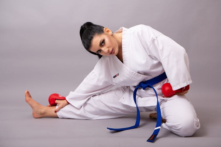 Woman In White Kimono Stretching