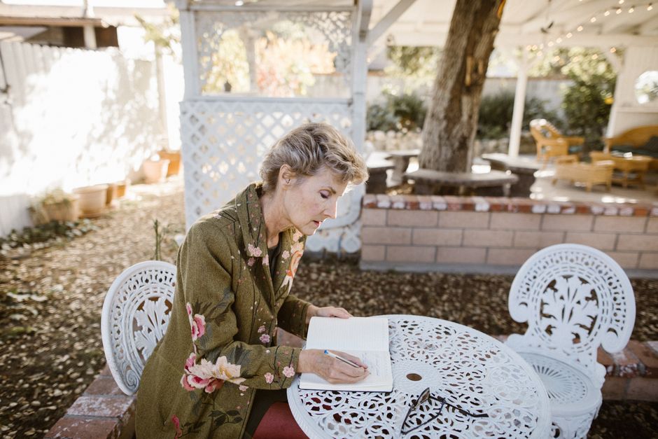person journaling in a quiet garden setting to process emotions - what to do when alcoholic spouse relapses person journaling in a quiet garden setting to process emotions - what to do when alcoholic spouse relapses
