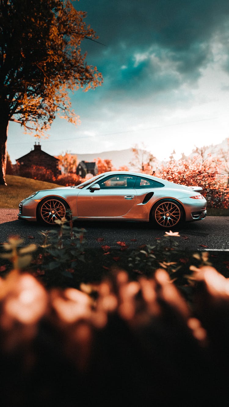 A Silver Car On The Road