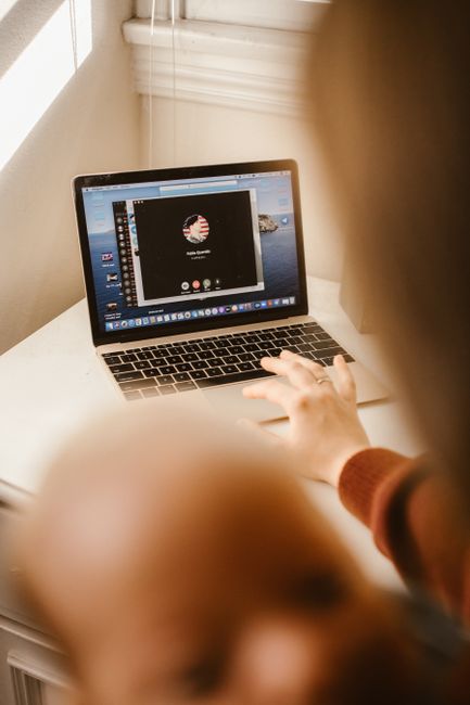 person working laptop video call