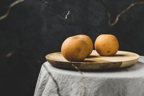 Photograph of Pears on a Wooden Tray