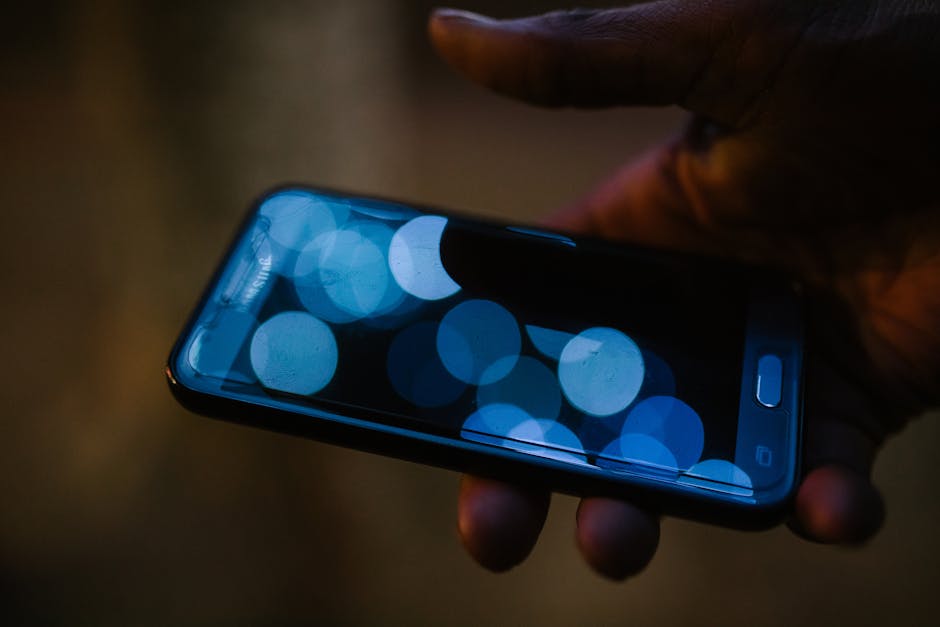 Person Holding Black Android Smartphone