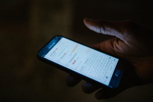 Close-Up Shot of a Person Using a Smartphone