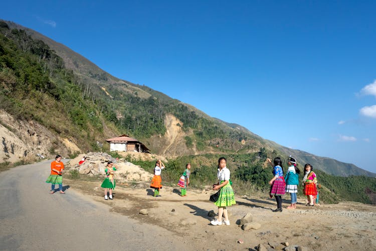 Asian Kids Playing In Mountainous Terrain