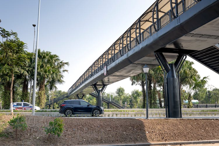 Cars On Roads With Bridge In Tropical City