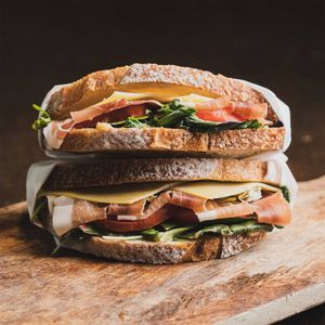Gourmet sandwich with cured meat, cheese and greens — photo by rajdeepcraft on Pexels