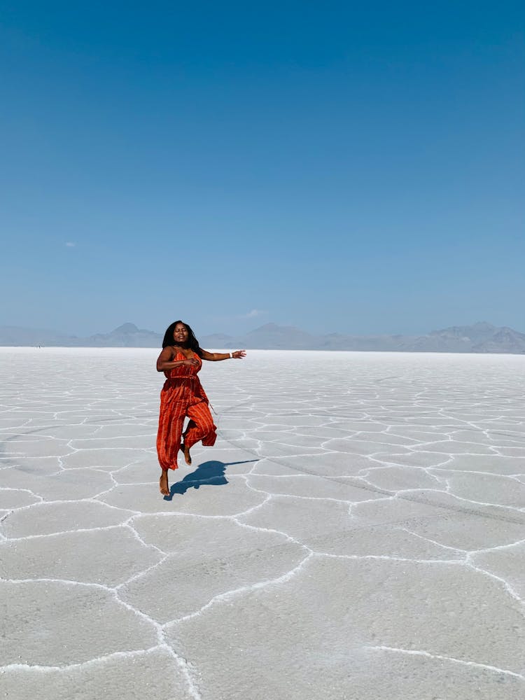 A Woman Walking In Bonaville Salt Flats