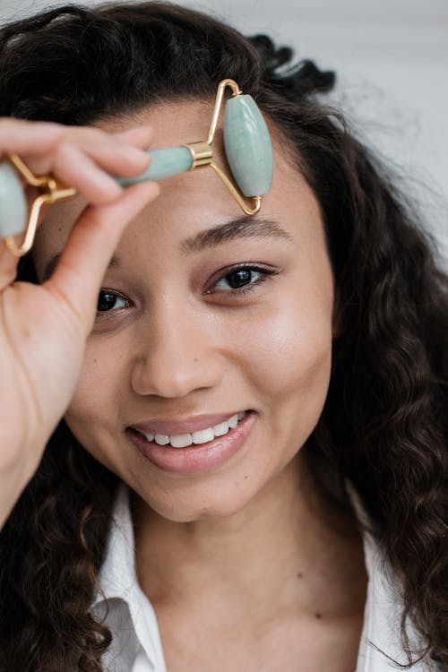 Free stock photo of beauty, facial roller, looking at camera