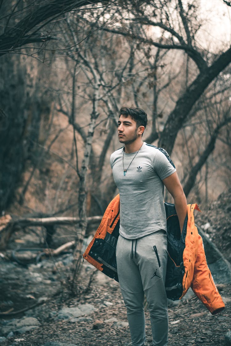 A Man Removing His Jacket