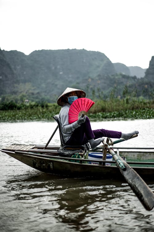 A Person Riding a Wooden Boat