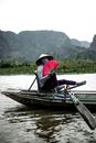 A Person Riding a Wooden Boat