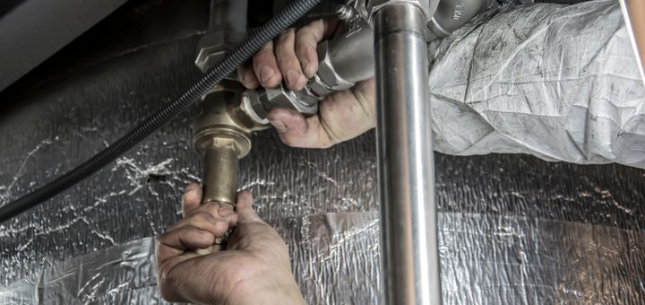 Plumber fitting new pipes
